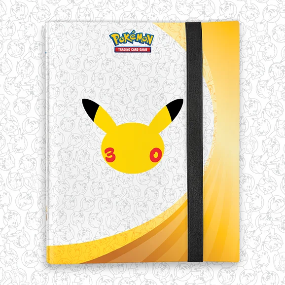 The 30th Celebration binder: a white cover with a Pikachu face holding the number 30, a yellow swoosh down the right side and a black elastic strap