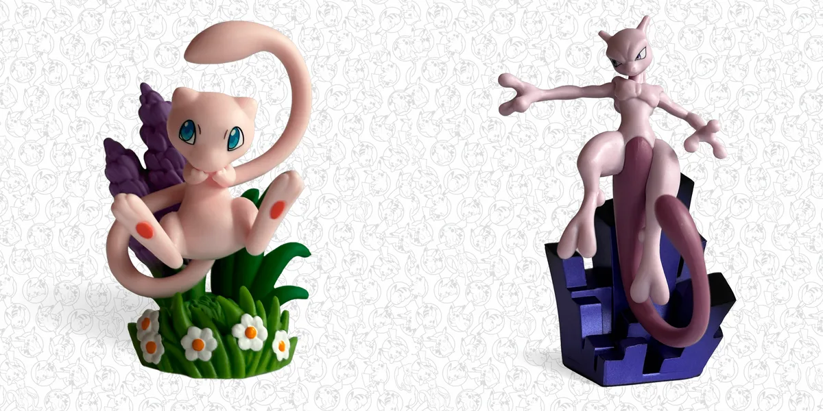 The two figures from the 30th Celebration Figure Collection: Mew curled on a grassy base with white flowers, and Mewtwo standing on a dark purple crystal base